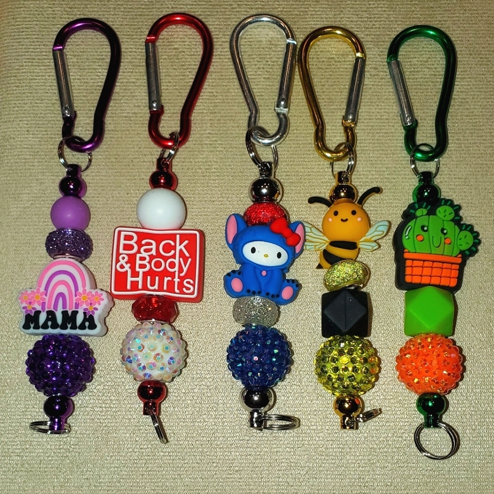 PICK ANY 5 BAG CLIPS/KEYCHAINS FOR $40